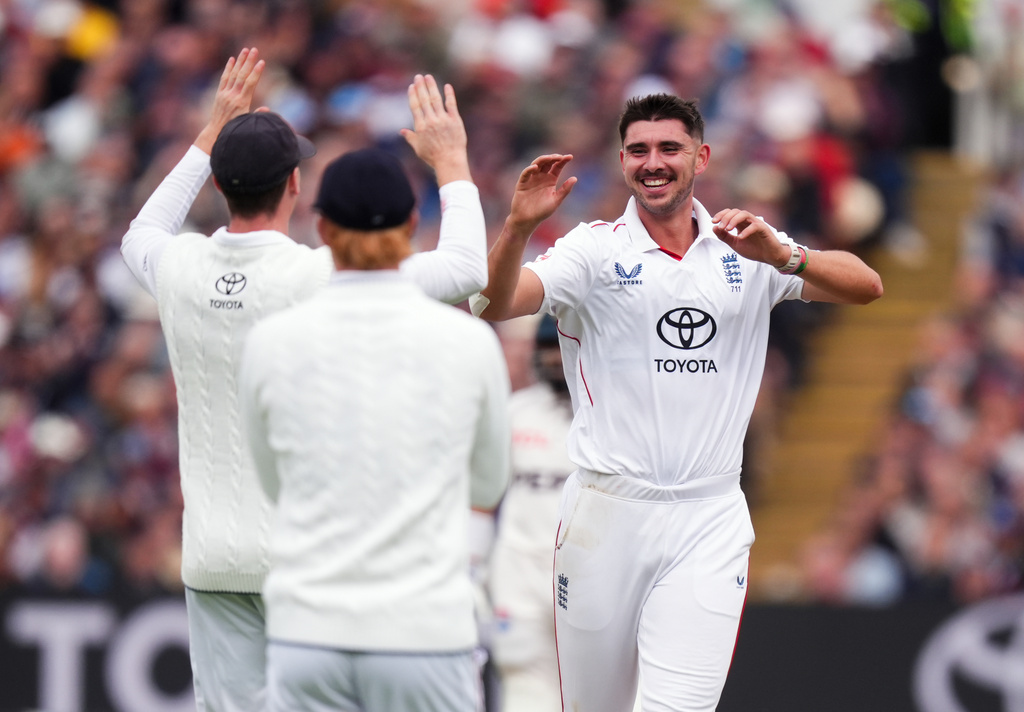 England's Josh Tongue, right, celebrates the wicket of Pakistan's Ghazi Ghori, during day one of the third cricket test match between England and Pakistan, at Edgbaston, in Birmingham, England, Wednesday, Sept. 9, 2026. (Mike Egerton/PA via AP)