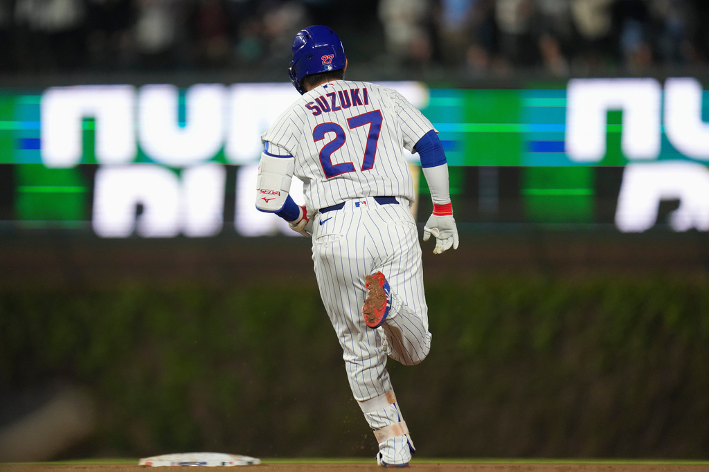 Chicago Cubs' Seiya Suzuki (27) runs the bases after a hitting two-run home run during the seventh inning of a baseball game against the Philadelphia Phillies, Tuesday, April 21, 2026, in Chicago. (AP Photo/Erin Hooley)