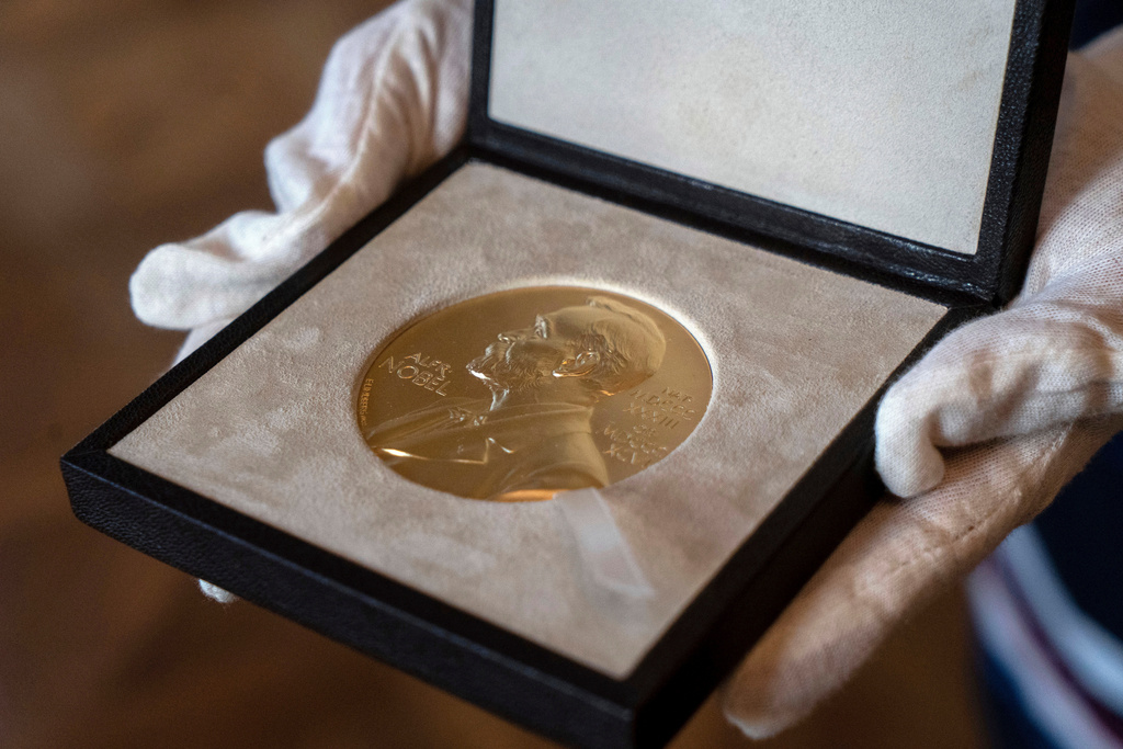 FILE - A Nobel medal is seen at the Swedish ambassador's residence in London, Dec. 8, 2020. (Niklas Halle'n/Pool via AP, File)