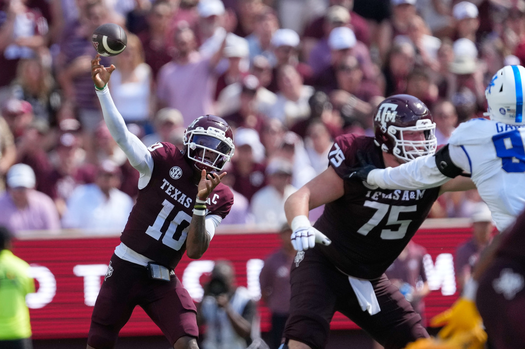 Texas A&M quarterback Marcel Reed (10) throws a pass against Kentucky during the first half of an NCAA college football game Saturday, Sept. 19, 2026, in College Station, Texas. (AP Photo/David J. Phillip)