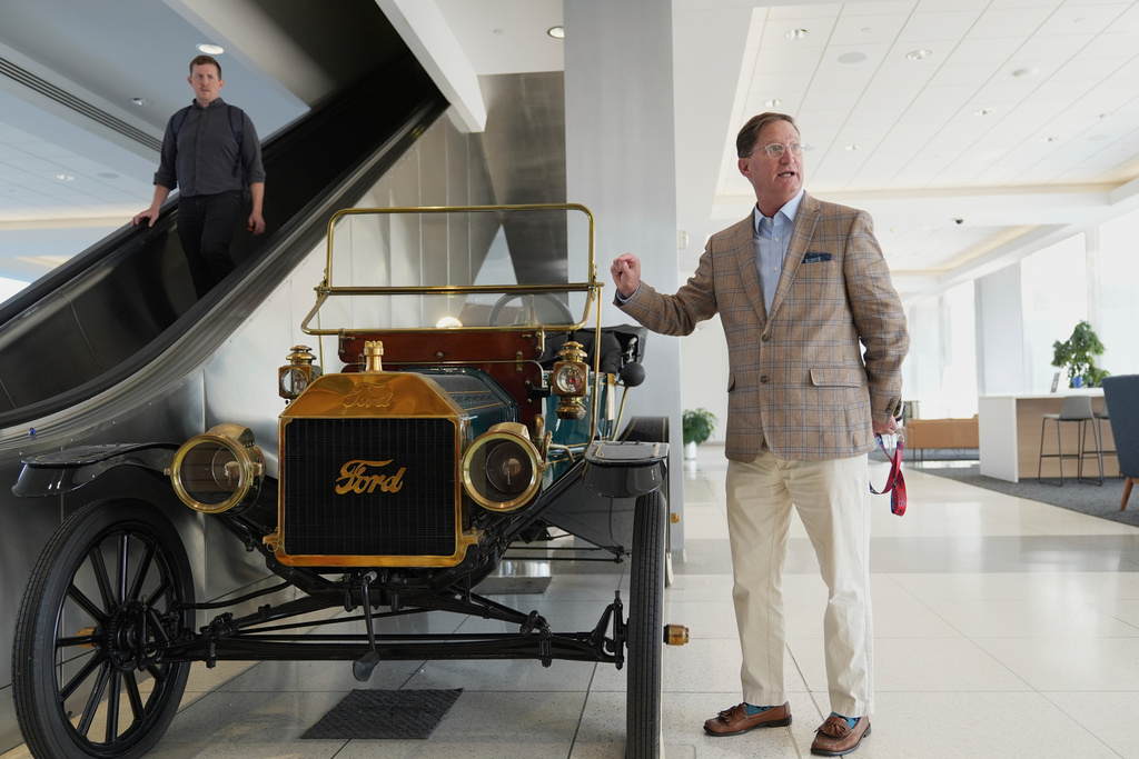 Ford heritage and brand manager Ted Ryan speaks in front of a vintage Ford Model T during an interview at the current Ford World Headquarters, Thursday, Sept. 11, 2025, in Dearborn, Mich. (AP Photo/Ryan Sun)