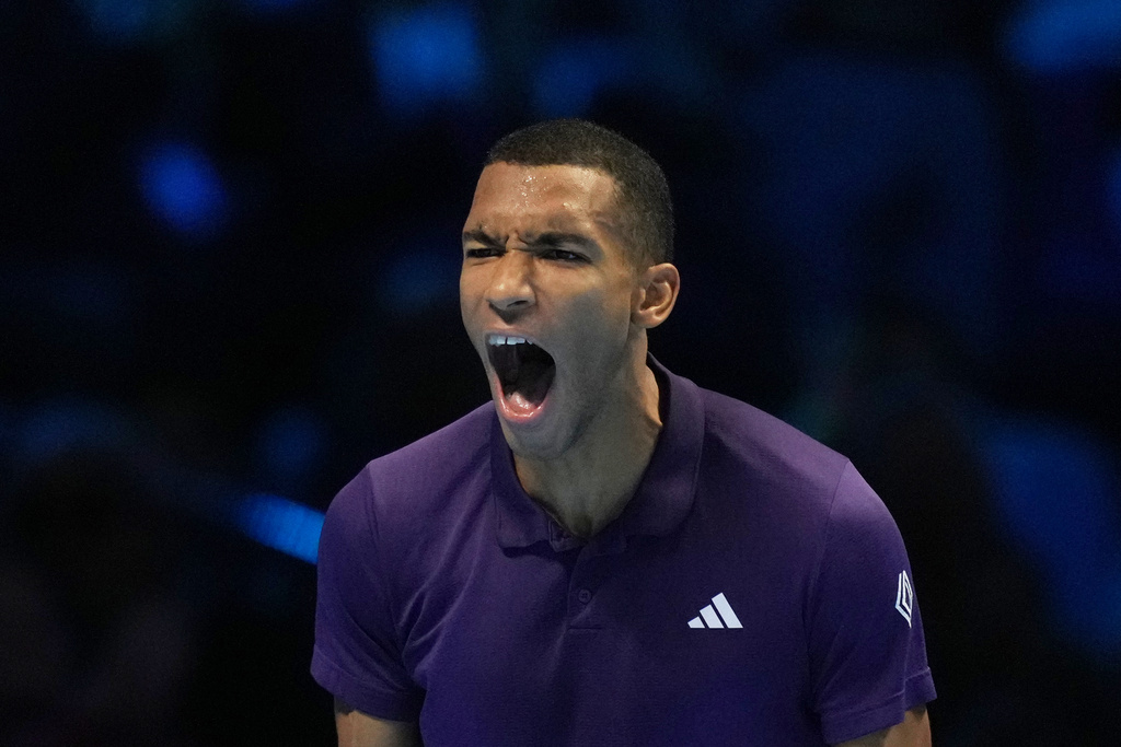 Canada's Felix Auger-Aliassime celebrates after winning against United States' Ben Shelton during their tennis match of the ATP World Tour Finals, in Turin, Italy, Wednesday, Nov. 12, 2025. (AP Photo/Antonio Calanni)