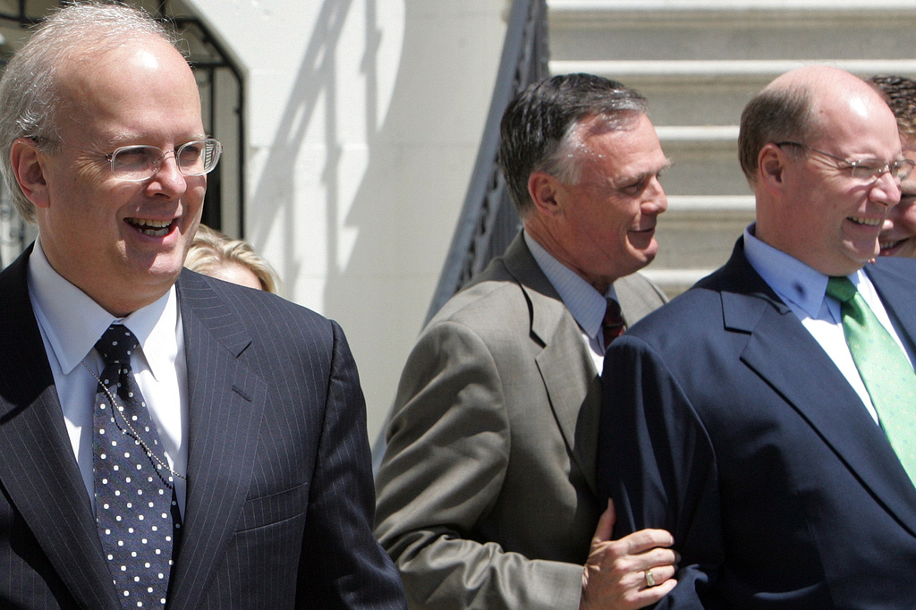 FILE - White House Deputy Chief of Staff Karl Rove, left, along with White House Chief Usher Gary Walters, center, and Deputy Chief of Staff Joseph Hagin, right , watch as President Bush departs the White House in Washington in this April 18, 2006 file photo. (AP Photo/Ron Edmonds, File)