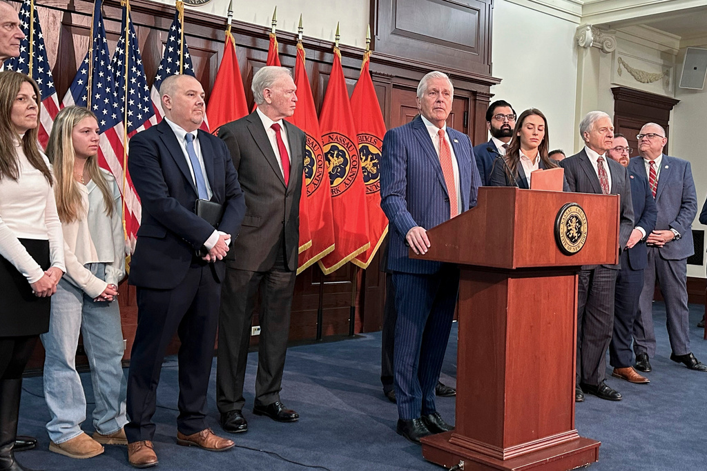 FILE - Nassau County Executive Bruce Blakeman, at podium, speaks during a news conference Wednesday, March 6, 2024, in Mineola, N.Y. (AP Photo/Philip Marcelo, File)
