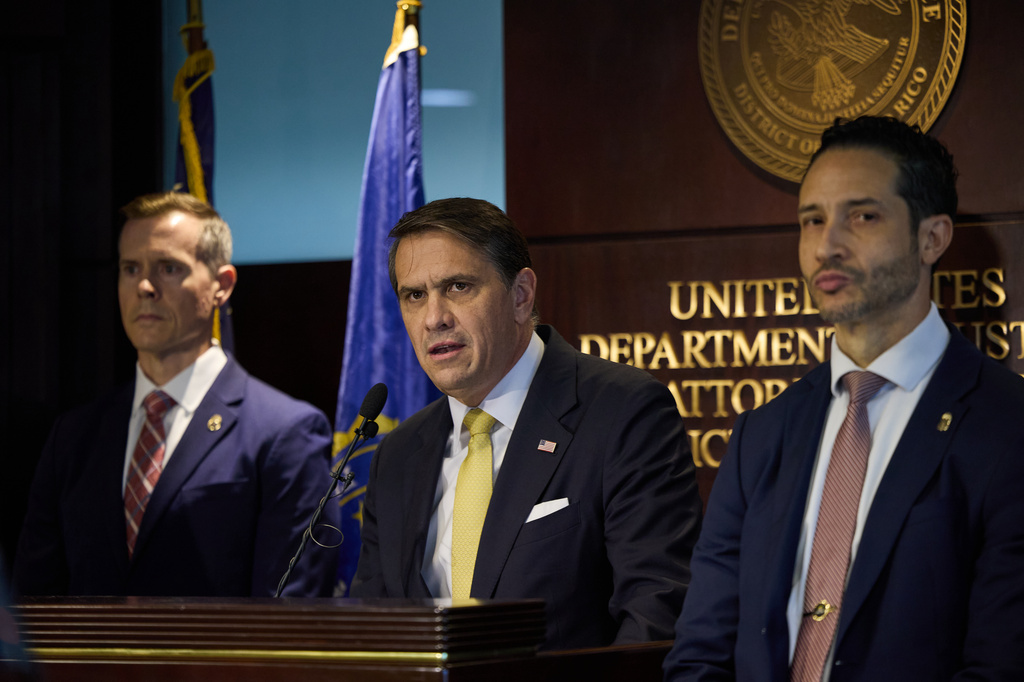 U.S. Attorney General Todd Blanche, center, gives a news conference about people charged in the takedown of Puerto Rican drug gang “Los Baja Deo” (LBD) in San Juan, Puerto Rico, Thursday, Aug. 27, 2026. (AP Photo/Stephanie Rojas)