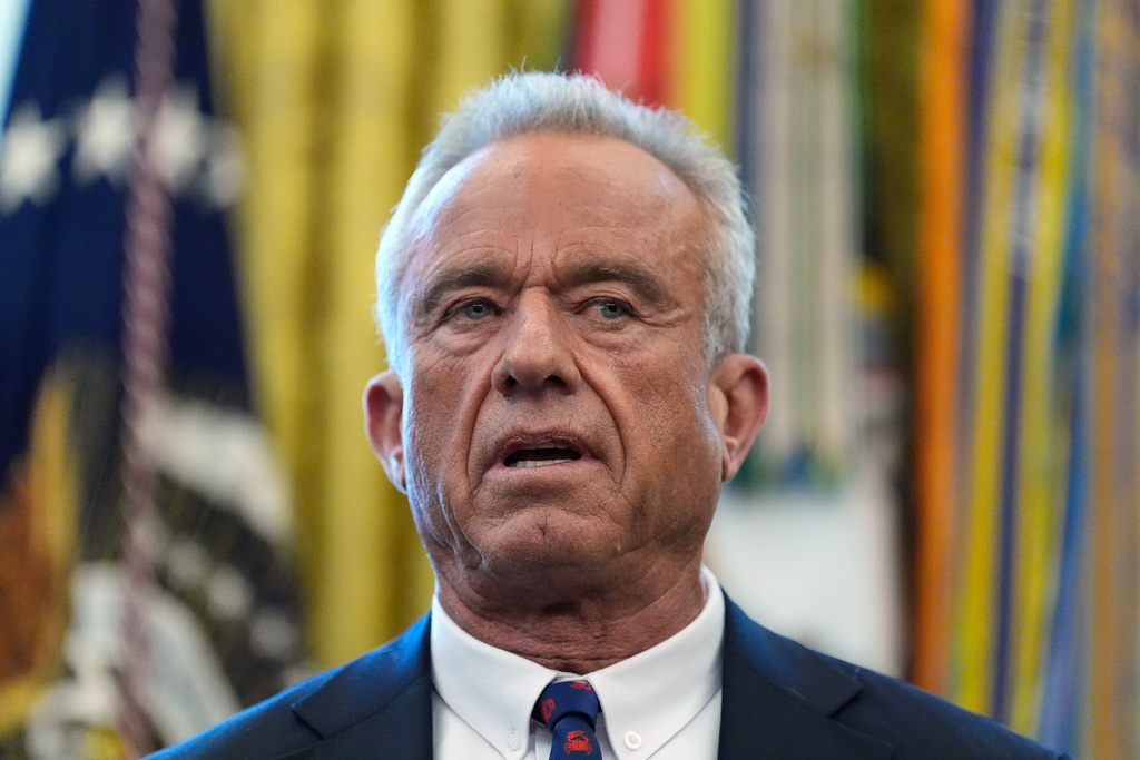 Health and Human Services Secretary Robert F. Kennedy Jr. speaks during an event with President Donald Trump in the Oval Office of the White House, Wednesday, Jan. 14, 2026, in Washington. (AP Photo/Alex Brandon)