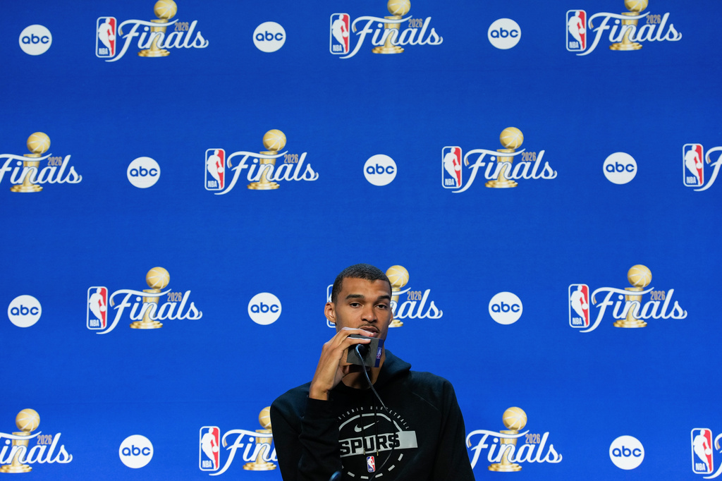 San Antonio Spurs forward Victor Wembanyama speaks during a news conference prior to Game 5 of the NBA Finals basketball series against the New York Knicks, Friday, June 12, 2026, in San Antonio. (AP Photo/Ross D. Franklin)