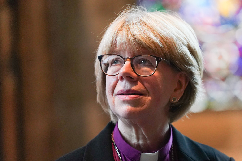 Sarah Mullally, the new Archbishop of Canterbury, spiritual leader of the world's 85 million Anglicans, poses for the media inside Canterbury Cathedral in Canterbury, England, Friday, Oct. 3, 2025. (AP Photo/Alberto Pezzali)