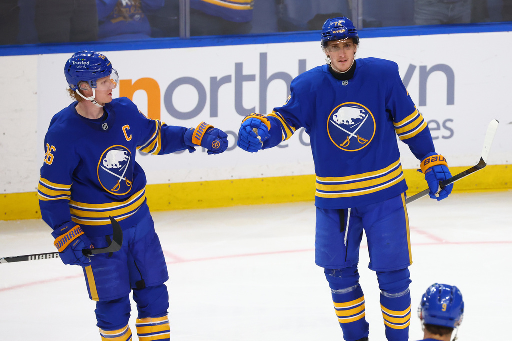 Buffalo Sabres center Tage Thompson (72) celebrates his goal with defenseman Rasmus Dahlin (26) during the third period of an NHL hockey game against the New York Islanders, Tuesday, March 31, 2026, in Buffalo, N.Y. (AP Photo/Jeffrey T. Barnes)