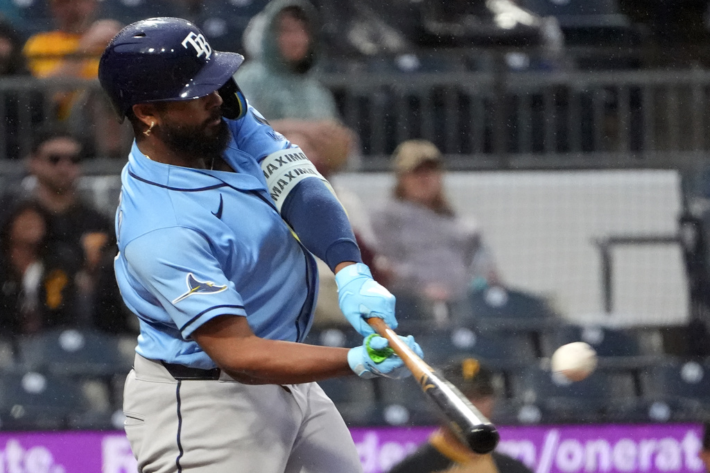 Tampa Bay Rays' Junior Caminero connects with a pitch from Pittsburgh Pirates pitcher Cam Sanders for an RBI double in the fifth inning of a baseball game in Pittsburgh, Saturday, April 18, 2026. (AP Photo/Tom E. Puskar)