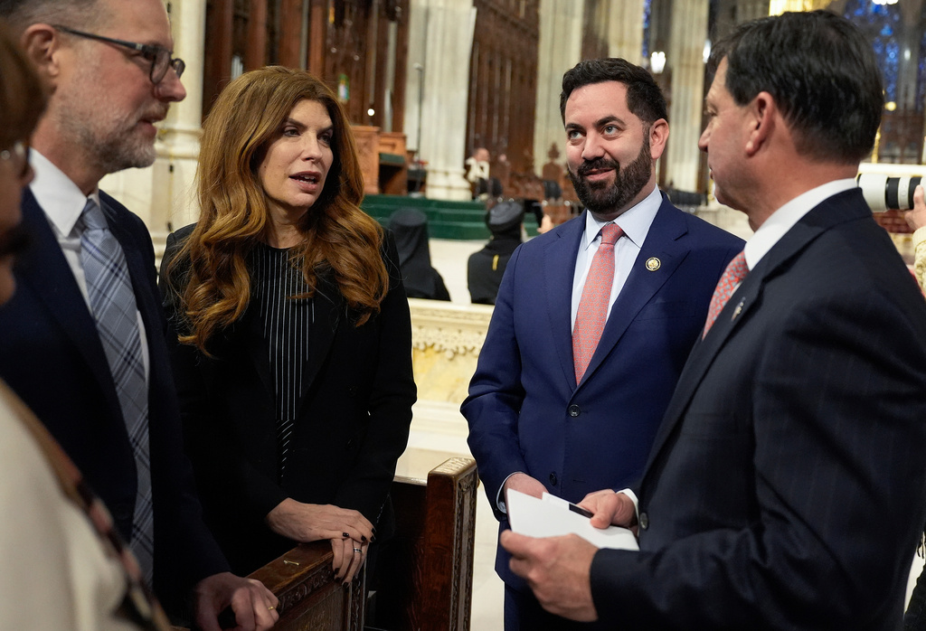 Rep. Mike Lawler, R-N.Y., second from right, arrives for the Mass of Installation of Archbishop Ronald Hicks at St. Patrick's Cathedral, Friday, Feb. 6, 2026, in New York. (AP Photo/Yuki Iwamura)