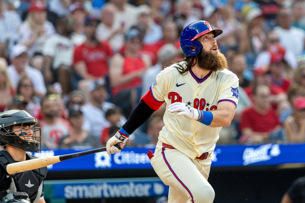 Philadelphia Phillies' Brandon Marsh follows through on a solo home run during the sixth inning of a baseball game against the Chicago White Sox, Saturday, June 6, 2026, in Philadelphia. (AP Photo/Laurence Kesterson)