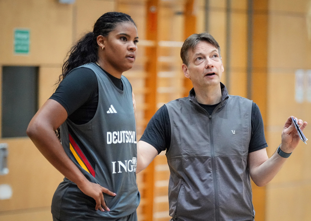 Geramny's head coach Olaf Lange, right, talks to player Nyara Sabally during a training session of team Germany in Berlin, Germany, Tuesday, Sept. 1, 2026, ahed of the The FIBA Women's Basketball World Cup. (Soeren Stache/dpa via AP)