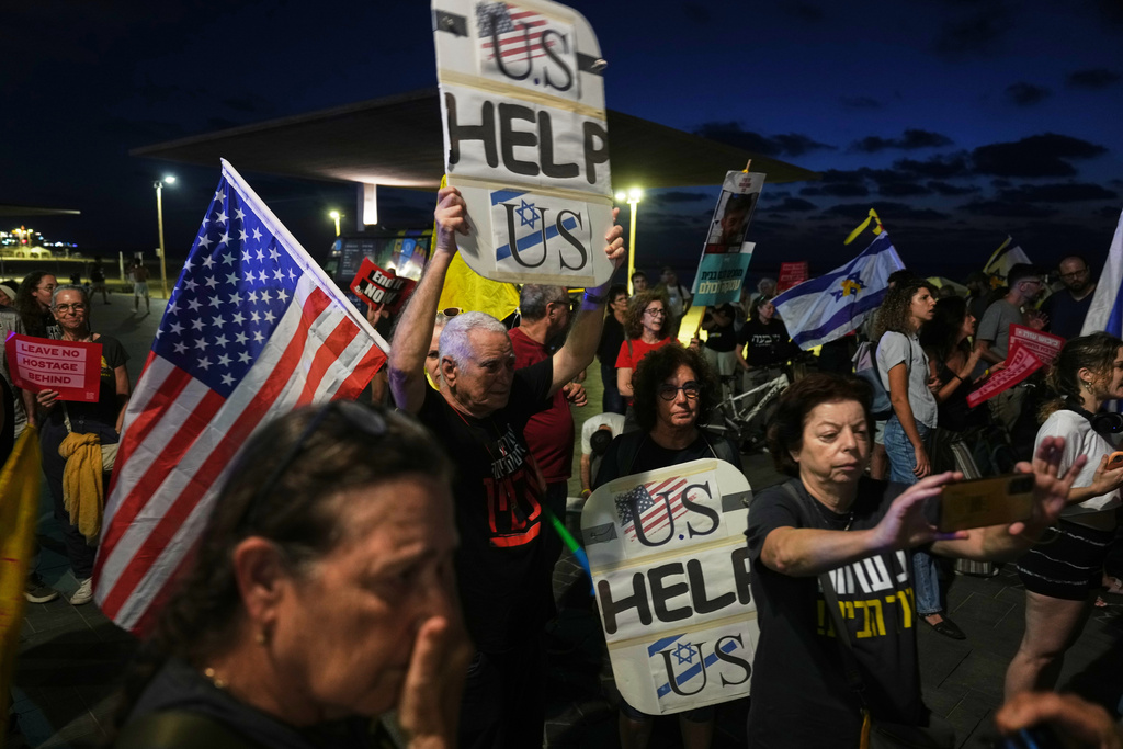 Relatives and supporters of hostages held by Hamas in the Gaza Strip calling for their immediate release and an end of the ongoing war, in front of the U.S. Embassy branch office in Tel Aviv, Israel, Monday, Sept. 29, 2025. (AP Photo/Ariel Schalit)