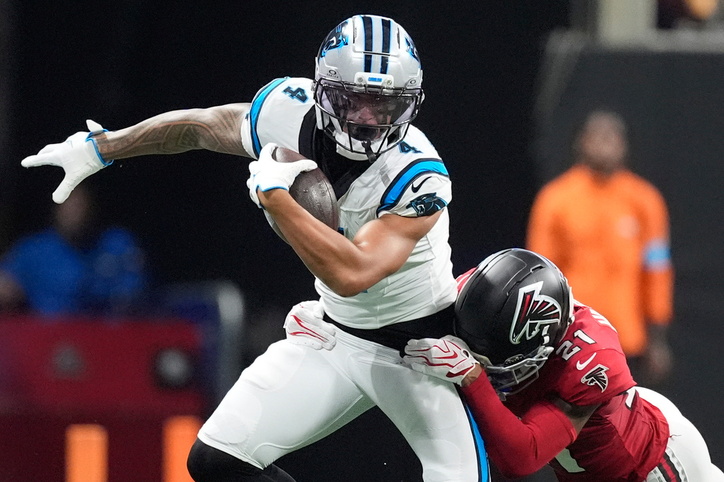 Atlanta Falcons cornerback Mike Hughes (21) tackles Atlanta Falcons wide receiver Jahan Dotson (4) during an NFL football game in Atlanta, Sunday, Sept. 20, 2026. (AP Photo/Mike Stewart)