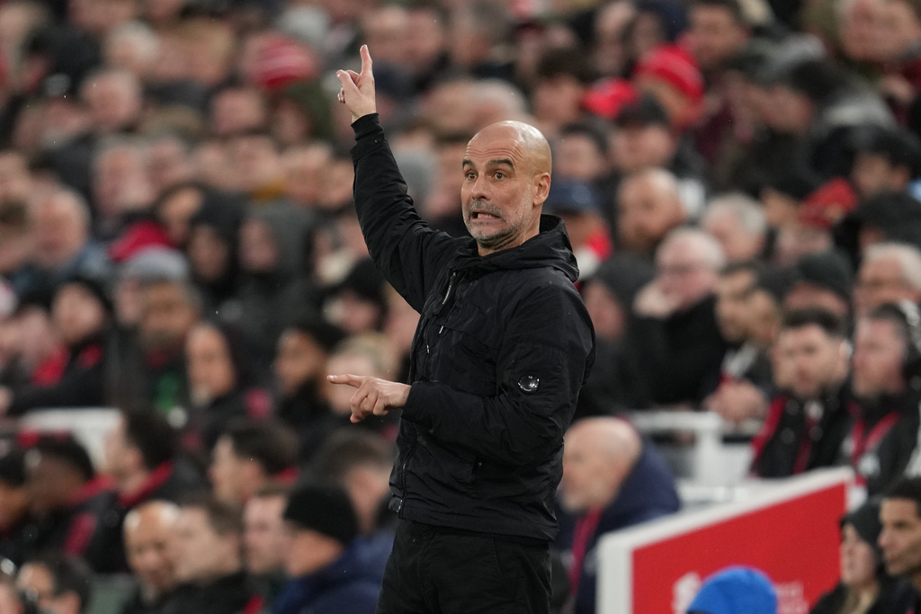 Manchester City's head coach Pep Guardiola gives instructions during the English Premier League soccer match between Liverpool and Manchester City in Liverpool, England, Sunday, Feb. 8, 2026. (AP Photo/Jon Super)