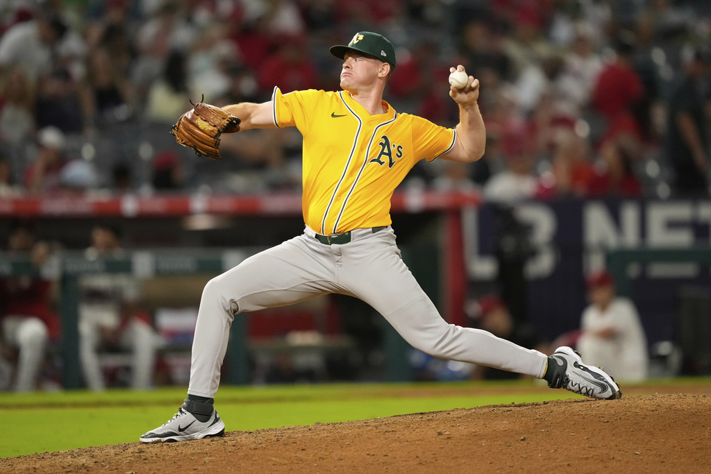 Athletics pitcher Brady Basso throws to the plate during the ninth inning of a baseball game against the Los Angeles Angels, Saturday, Sept. 6, 2025, in Anaheim, Calif. (AP Photo/Mark J. Terrill)