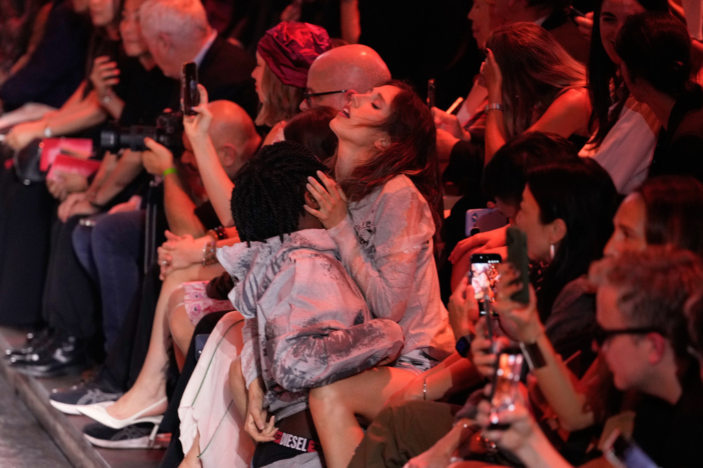 A couple perform during the Diesel women's Spring-Summer 2027 collection fashion show in Milan, Italy, Tuesday, Sept. 22, 2026. (AP Photo/Luca Bruno).