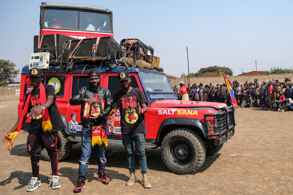 Supporters of Zambian incumbent President and United Party for National Development (UPND) presidential candidate Hakainde Hichilema attend a campaign rally on the outskirts of Lusaka, Zambia, Saturday, Aug. 8, 2026. (AP Photo/Anita Reed)