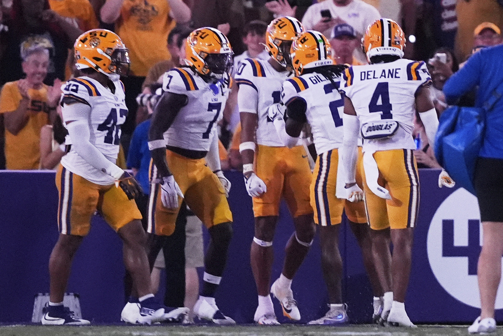 LSU celebrates a pick six by safety Dashawn Spears (10) in the second half of an NCAA college football game against Florida, Saturday, Sept. 13, 2025, in Baton Rouge, La. (AP Photo/Gerald Herbert)