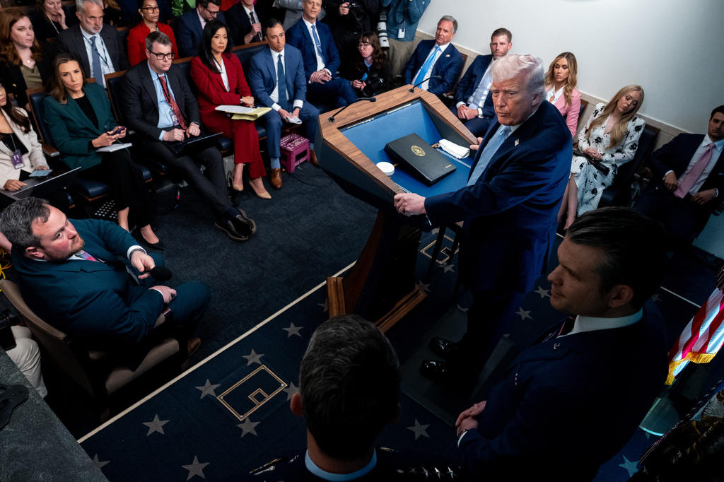 President Donald Trump, accompanied by Defense Secretary Pete Hegseth and Chairman of the Joint Chiefs of Staff Gen. Dan Caine, speaks with reporters in the James Brady Press Briefing Room at the White House, Monday, April 6, 2026, in Washington. (AP Photo/Julia Demaree Nikhinson)