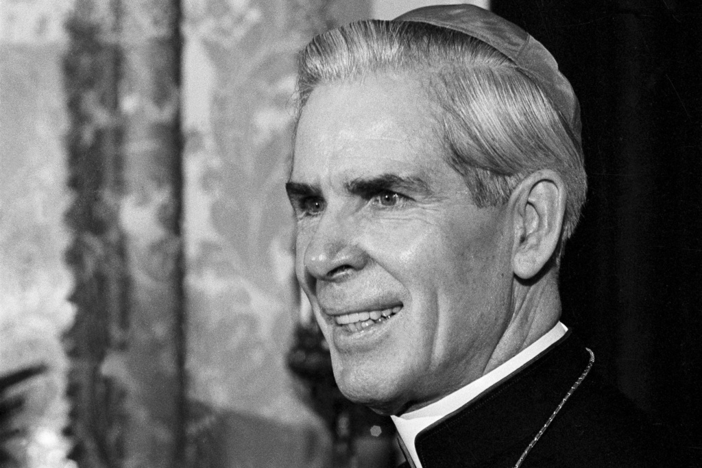 FILE - This Oct. 26, 1966 file photo shows Bishop Fulton J. Sheen in his office at the Propagation of Faith in New York. (AP Photo/Eddie Adams, file)