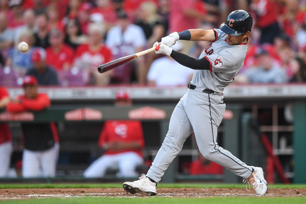 Cleveland Guardians' Steven Kwan hits a single during the third inning of a baseball game against the Cincinnati Reds in Cincinnati, Wednesday, July 29, 2026. (AP Photo/Tanner Pearson)