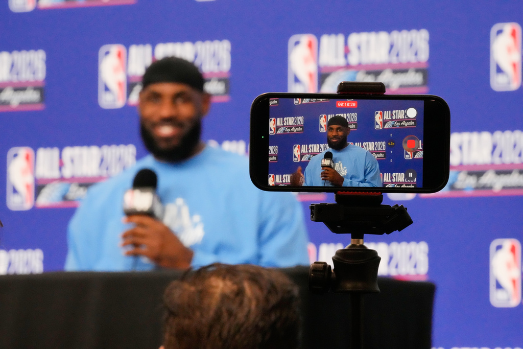 USA Stripes forward LeBron James (23) answers questions before the NBA All-Star basketball game Sunday, Feb. 15, 2026, in Inglewood, Calif. (AP Photo/Mark J. Terrill)