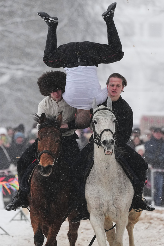 FILE - Riders show off their skills during Maslenitsa, or Shrovetide holiday celebrations in St. Petersburg, Russia, Feb. 22, 2026. (AP Photo/Dmitri Lovetsky, File)