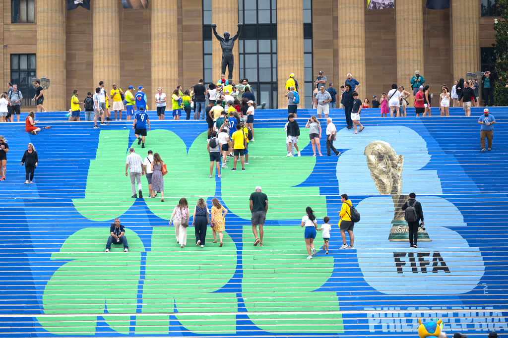 Brazilian and other soccer fans climb the steps leading to the Rocky statue, marked with a FIFA World Cup logo, in Philadelphia, on Thursday, June 18, 2026, ahead of Friday's FIFA World Cup Group C match between Brazil and Haiti. (Jose F. Moreno/The Philadelphia Inquirer via AP)/The Philadelphia Inquirer via AP)