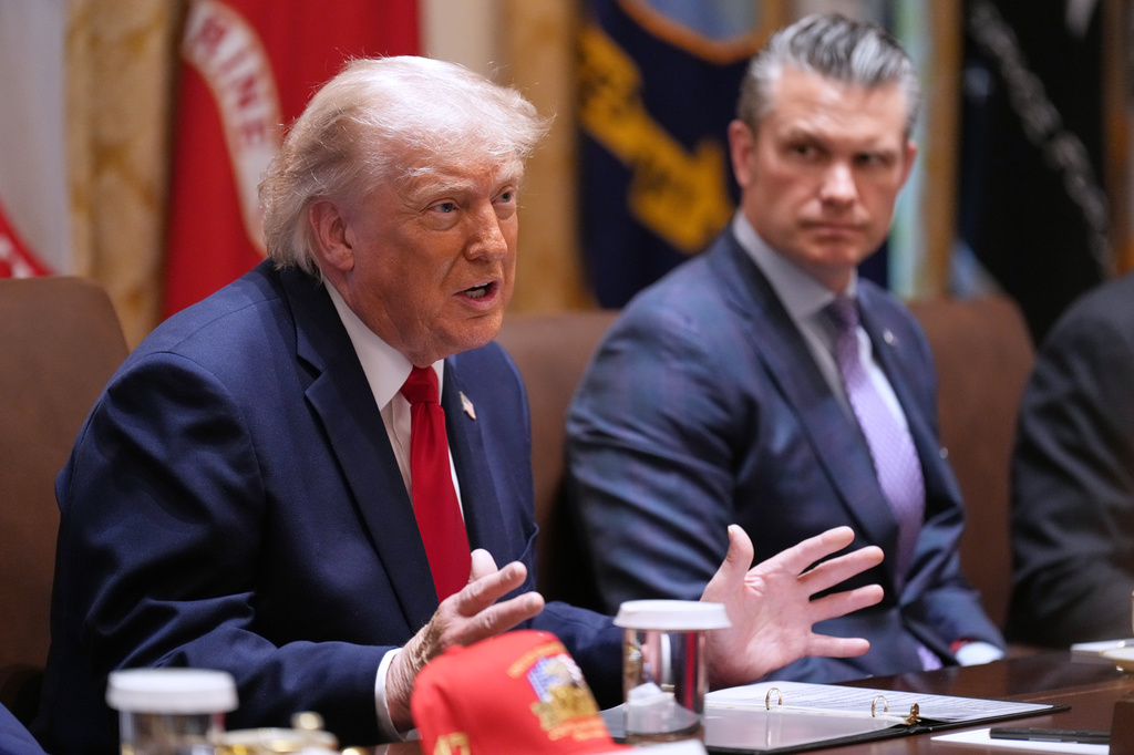 President Donald Trump speaks during a Cabinet meeting at the White House, Wednesday, May 27, 2026, in Washington, as Secretary of Defense Pete Hegseth, looks on. (AP Photo/Jacquelyn Martin)