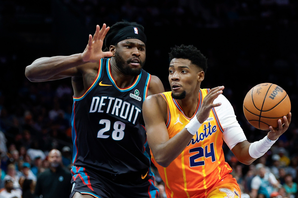 Charlotte Hornets forward Brandon Miller (24) drives to the basket against Detroit Pistons forward Isaiah Stewart (28) during the first half of an NBA basketball game in Charlotte, N.C., Friday, April 10, 2026. (AP Photo/Nell Redmond)