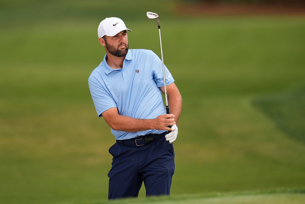 Scottie Scheffler chips onto the ninth green during the final round of the RBC Heritage golf tournament Sunday, April 19, 2026, in Hilton Head, S.C. (AP Photo/Mike Stewart)