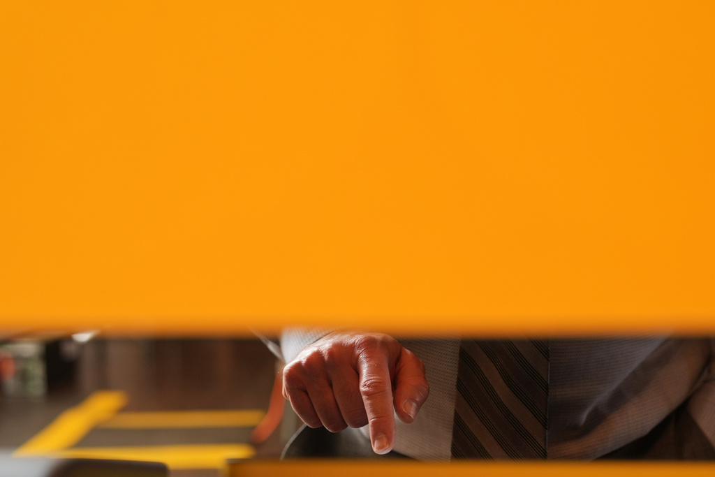 A voter casts his ballot in Beverly Hills, Calif., Tuesday, Nov. 4, 2025. (AP Photo/Jae C. Hong)