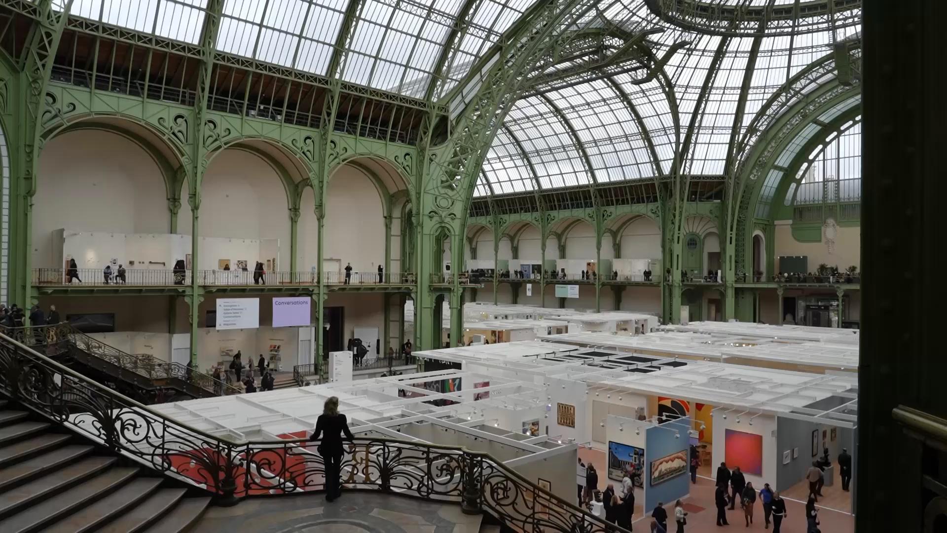 Art Basel's Paris edition is bringing galleries from around the world to the Grand Palais. The prestigious contemporary art fair is taking place amid heightened security following violent protests in the French capital. (AP video/Elitsa Gadeva)