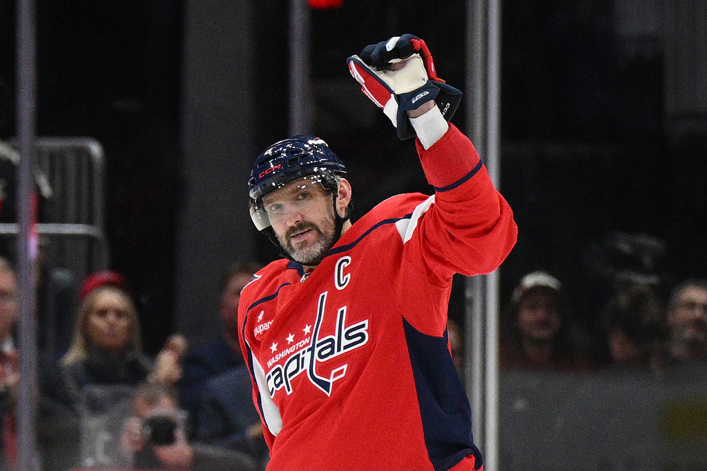 Washington Capitals left wing Alex Ovechkin (8) celebrates his 900th career NHL goal during the second period of an NHL hockey game against the St. Louis Blues, Wednesday, Nov. 5, 2025, in Washington. (AP Photo/Nick Wass)