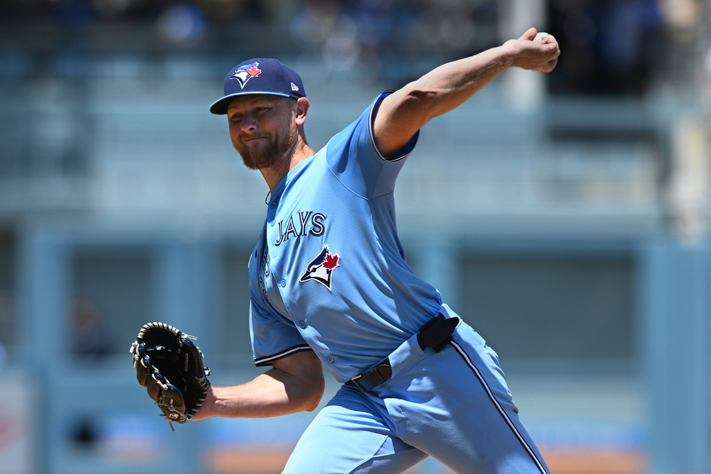 Toronto Blue Jays pitcher Eric Lauer throws a pitch against the Los Angeles Dodgers during the first inning of a baseball game, Sunday, Aug. 10, 2025, in Los Angeles. (AP Photo/Wally Skalij)