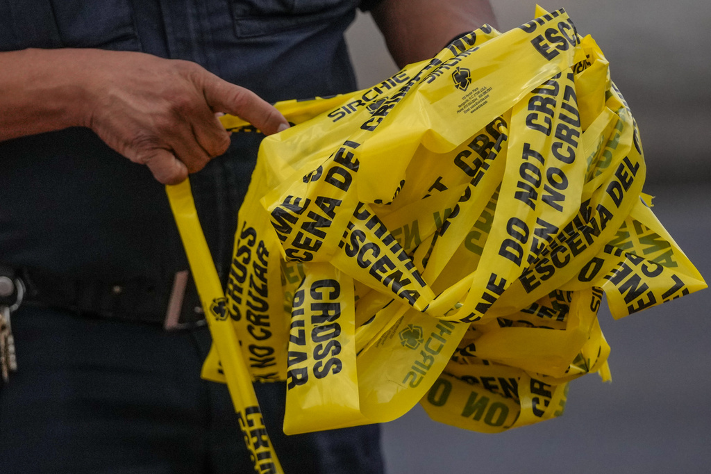 Police work on Canal Street in Houston, Tuesday, July 7, 2026, after a shooting. (Jacob Lujan/Houston Chronicle via AP)