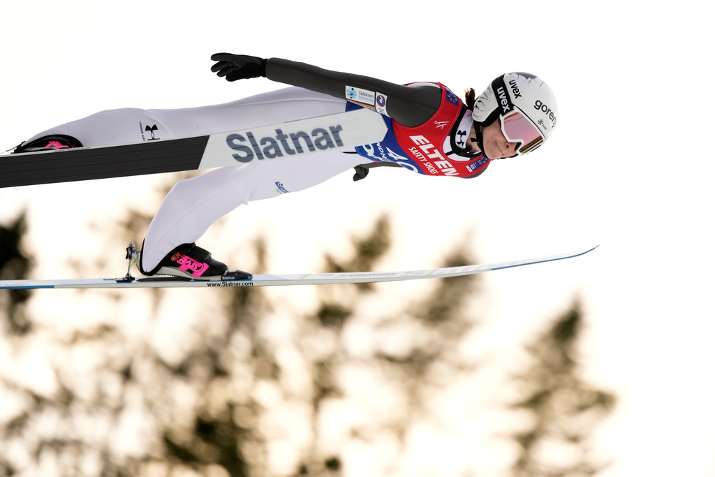 FILE - Nika Prevc, of Slovenia, soars through the air during her first round jump of the ski jumping women's large hill individual competition at the Nordic World Ski Championships in Trondheim, Norway, March 7, 2025. (AP Photo/Matthias Schrader, File)