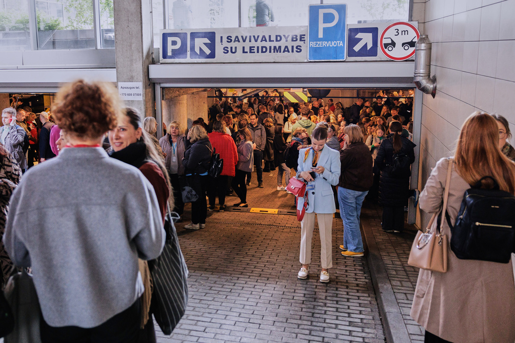 People take shelter in an underground car park during an air raid alert in Vilnius, Lithuania, Wednesday, May 20, 2026. (Vygintas Skaraitis/Lrytas via AP)