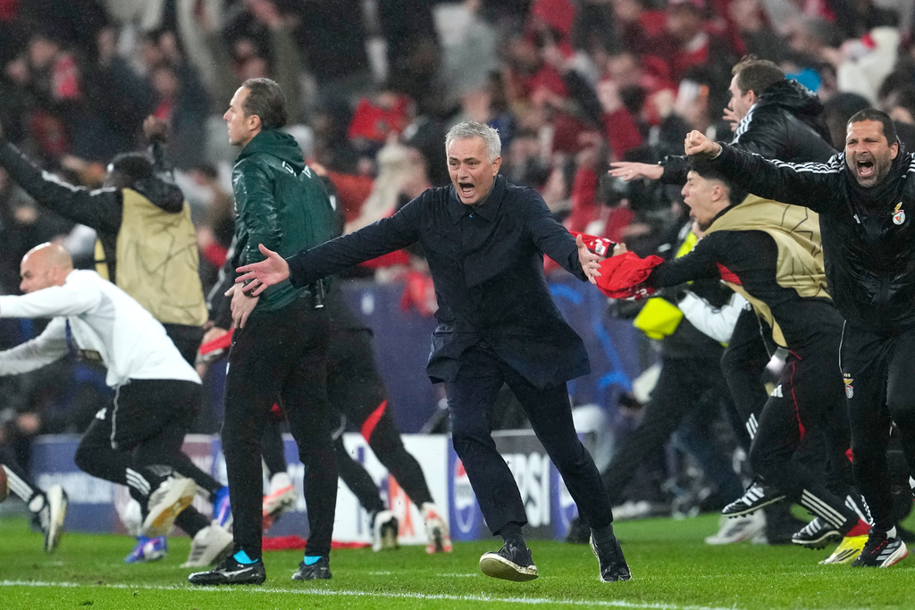Benfica's head coach Jose Mourinho runs celebrating at the end of a Champions League opening phase soccer match between Benfica and Real Madrid, in Lisbon, Wednesday, Jan. 28, 2026. (AP Photo/Armando Franca)