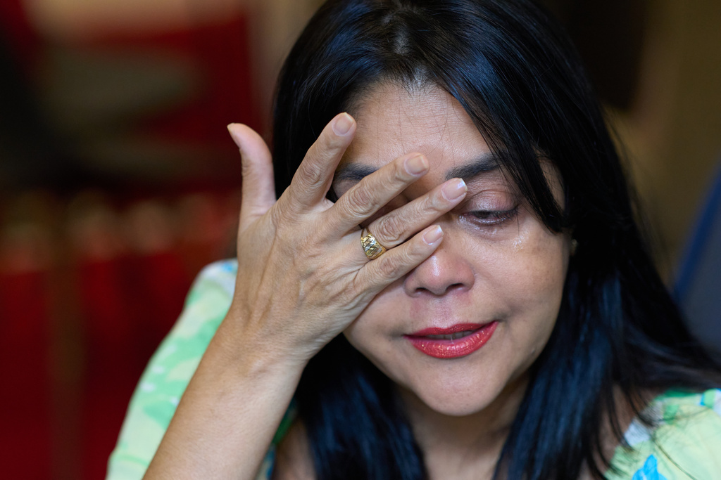 Simone Guimarães gets emotional during an interview with AP, in Sao Goncalo, Rio de Janeiro state, Wednesday, Nov 19, 2025. (AP Photo/Silvia Izquierdo)