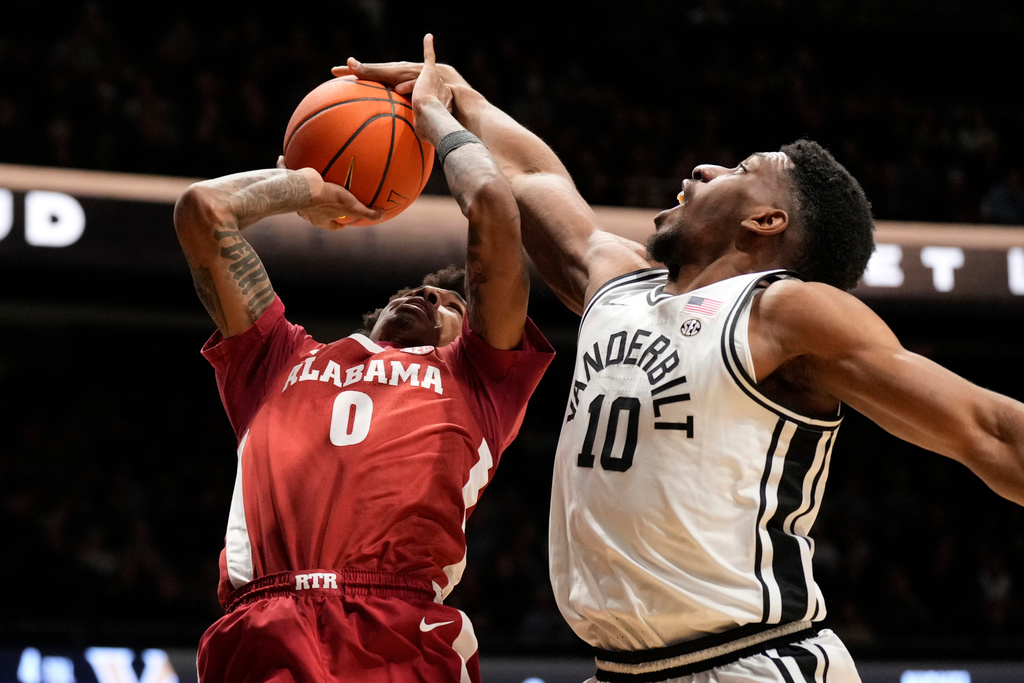 Vanderbilt forward Ak Okereke (10) blocks a shot by Alabama guard Labaron Philon (0) during the first half of an NCAA college basketball game Wednesday, Jan. 7, 2026, in Nashville, Tenn. (AP Photo/George Walker IV)