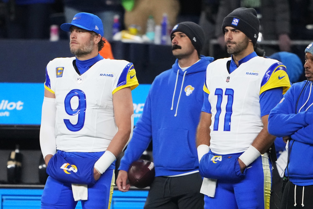Los Angeles Rams quarterback Matthew Stafford (9) quarterback Jimmy Garoppolo (11) watch from the sideline in the closing minutes of a loss to the Seattle Seahawks in the NFC Championship NFL football game Sunday, Jan. 25, 2026, in Seattle. (AP Photo/Lindsey Wasson)