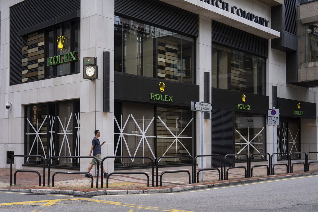 Taped-up windows at a luxury store ahead of the super typhoon Ragasa approaching Hong Kong, Tuesday, Sept. 23, 2025. (AP Photo/Chan Long Hei)