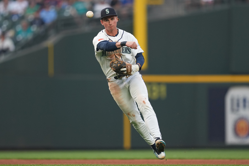 Seattle Mariners infielder Colt Emerson throws to first off a ground ball from Detroit Tigers Javier Báez during the top of the fourth inning of a baseball game, Tuesday, Aug. 4, 2026, in Seattle. (AP Photo/Eric Hiller)
