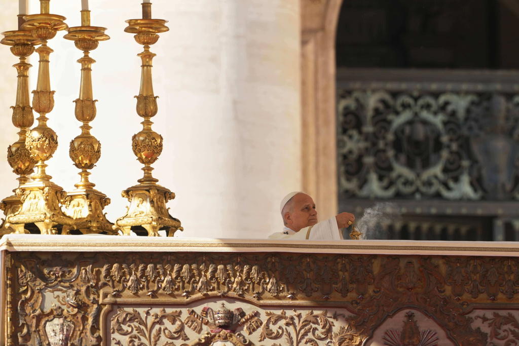 Pope Leo XIV presides over Mass with participants in the Jubilee of the Educational World on the Solemnity of All Saints, in St. Peter's Square, at the Vatican, Saturday, Nov. 1, 2025, during which he will proclaim St. John Henry Newman a Doctor of the Church. (AP Photo/Andrew Medichini)