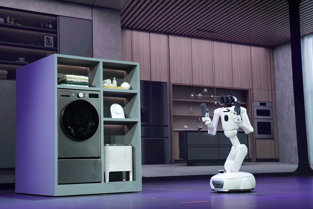 CLOiD, an LG Electronics home robot, takes the stage during an LG Electronics news conference ahead of the CES tech show Monday, Jan. 5, 2026, in Las Vegas. (AP Photo/Abbie Parr)