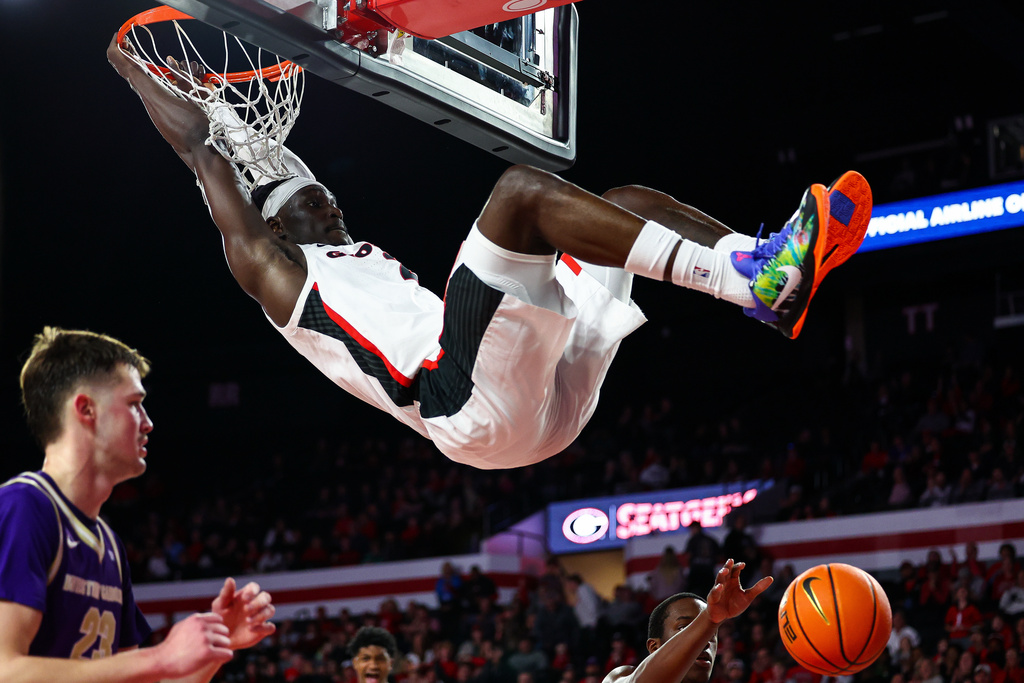 Georgia center Somto Cyril, center, dunks during the first half of an NCAA college basketball game against Western Carolina, Thursday, Dec. 18, 2025, in Athens, Ga. (AP Photo/Colin Hubbard)