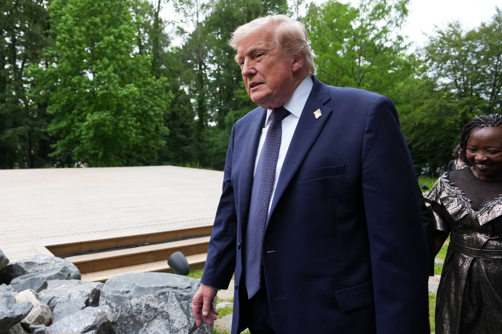 U.S. President Donald Trump walks away after a group photo of leaders at the G7 summit, Tuesday, June 16, 2026, in Evian-les-Bains, France. (AP Photo/Julia Demaree Nikhinson)